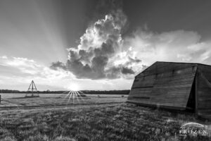 A wonderful sunset over Huffman Prairie where the setting sun illuminates a disappating thunderstorm.