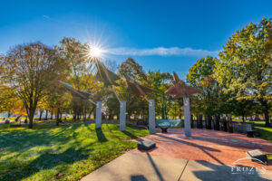 A memorial depicting a formation of aircraft where the lead aircraft has begun pulling up creating a missing man salute