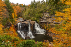 A dramatic West Virginia waterfall where the Black River spills over a formation 60 feet into a pool of water as autumn color filled the surrounding forest.