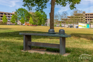 A bronze bench featuring two Bowler Hats that pays tribute to Orville and Wilbur Wright. This David Black creation resides in Dayton's Levitt Pavilion.