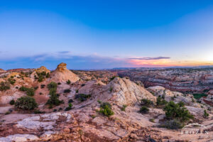 View of Grand Staircase-Escalante National Monument at twilight as distant storms gather on the horizon
