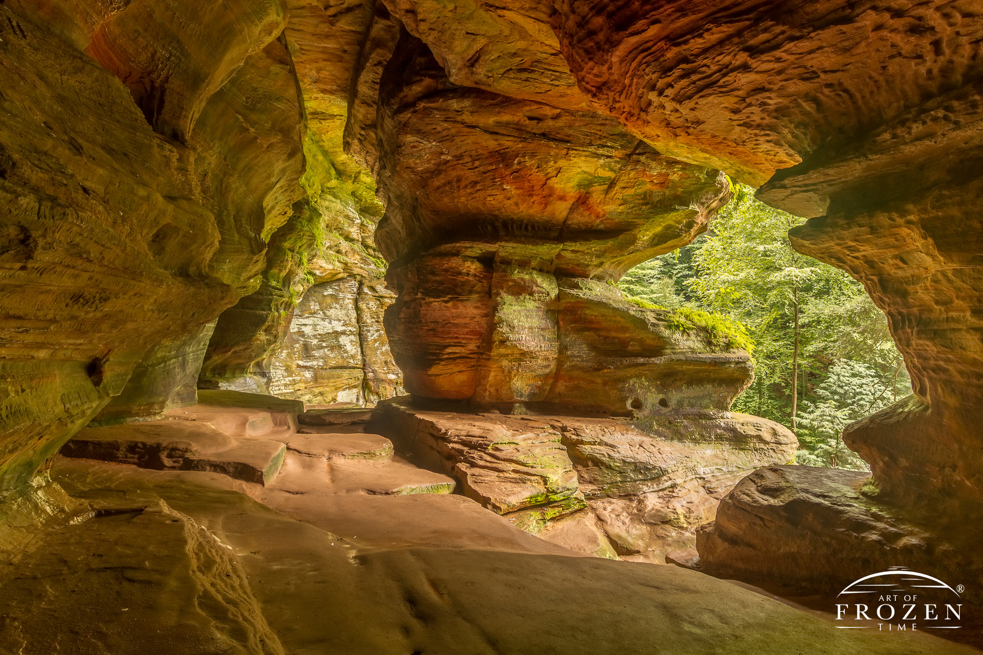 Interior panoramic view of the Rock House Cave showing various openings to the gorge below.