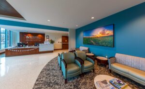 A large canvas print of Huffman Prairie during a colorful sunset in the waiting room of the Kettering Health Network Cancer Center