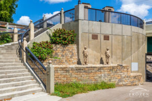 A stone staircase connecting Veteran’s Bridge to the Buck Creek Bike Trail featuring stone Desert Storm era soldiers carved from stone.