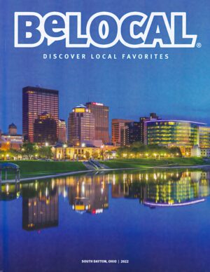 The cover image on BeLocol South Dayton magazine of the Dayton Skyline during twilight