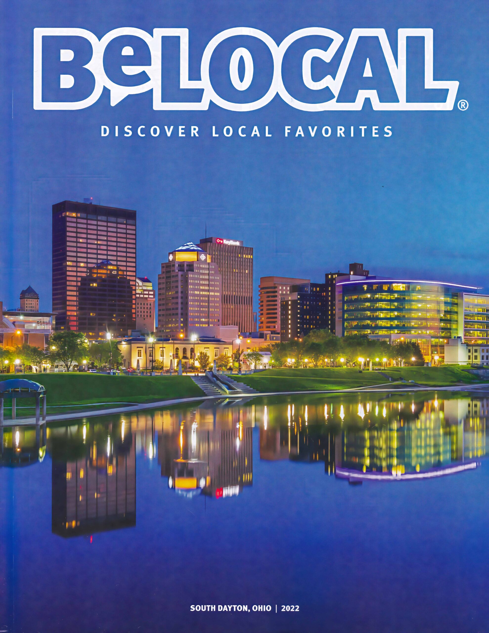 The cover image on BeLocol South Dayton magazine of the Dayton Skyline during twilight