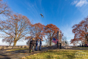 Wright Brothers Memorial Ceremony honoring the Brothers first flight as a C-17 from Wright-Patterson AFB banks over head