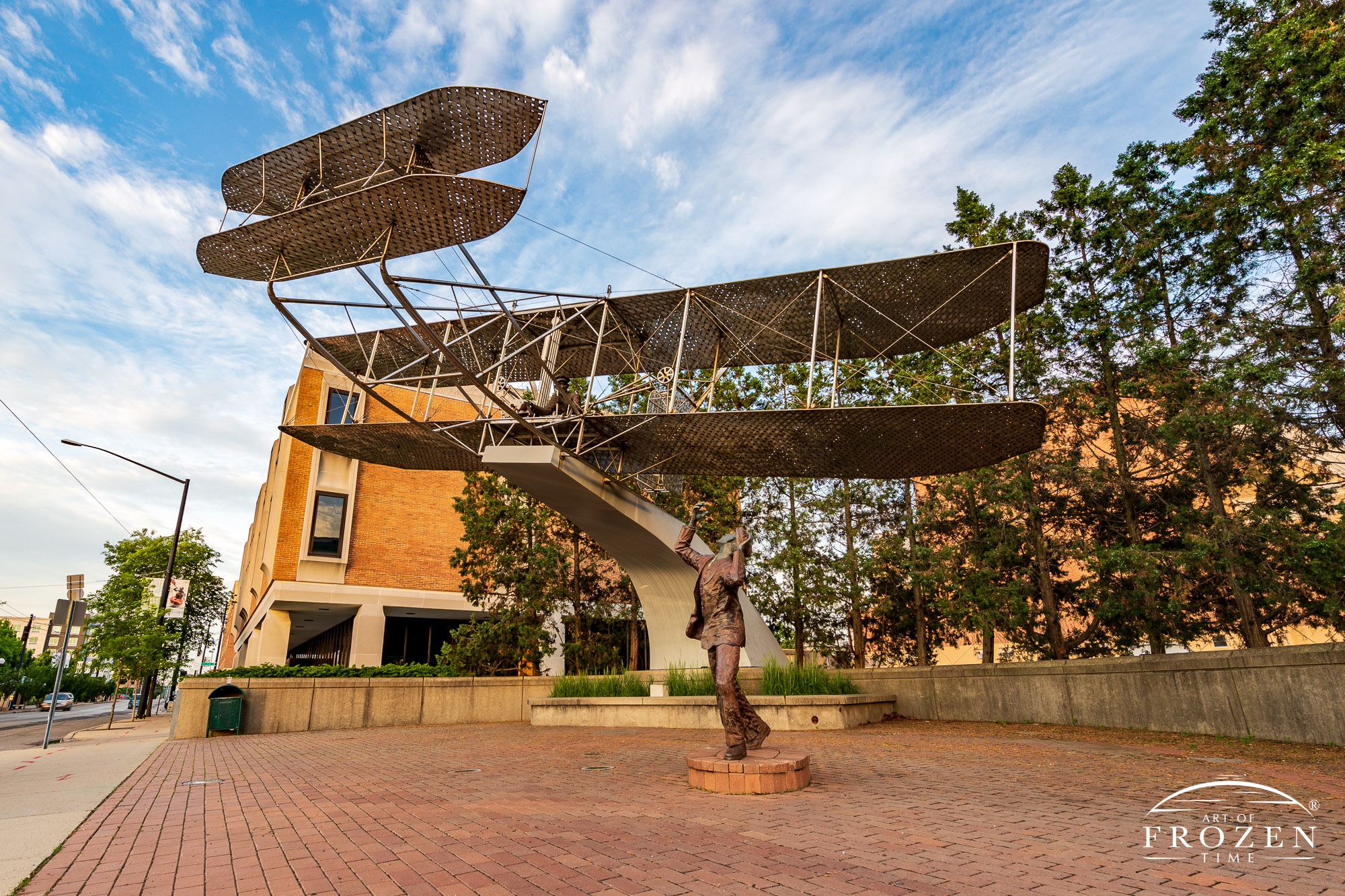 A stainless steel sculpture of the Wright Brothers flying their 1905 Wright Flyer as it sits along Monument Street in RiverScape MetroPark