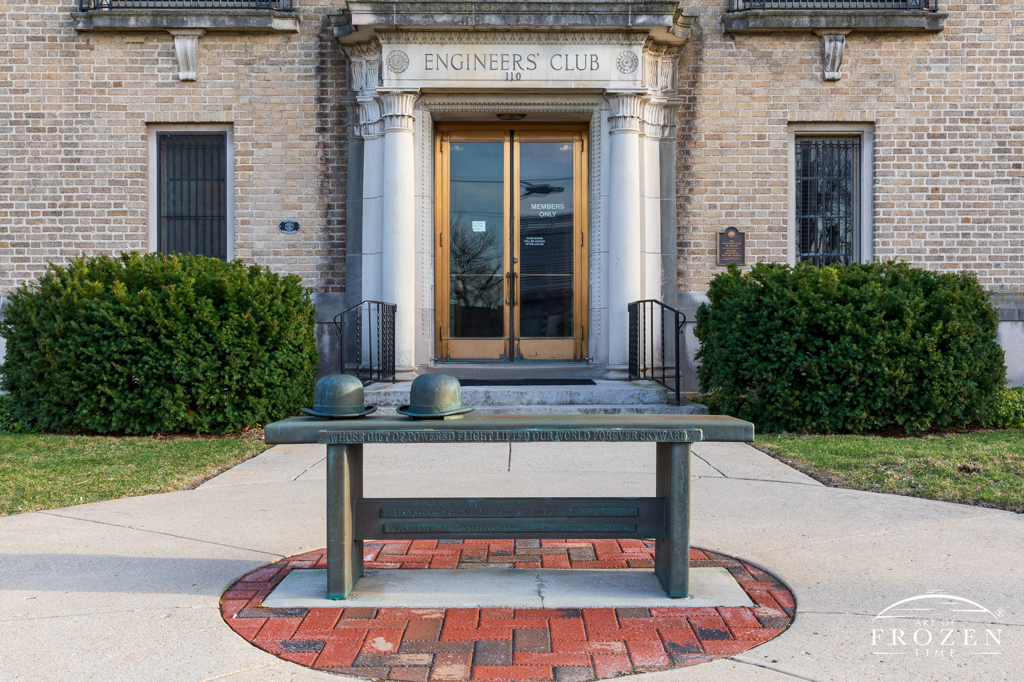 The front facade of the Engineers’ Club, Dayton Ohio along with one of 10 Wright Brothers Benches created by David Black
