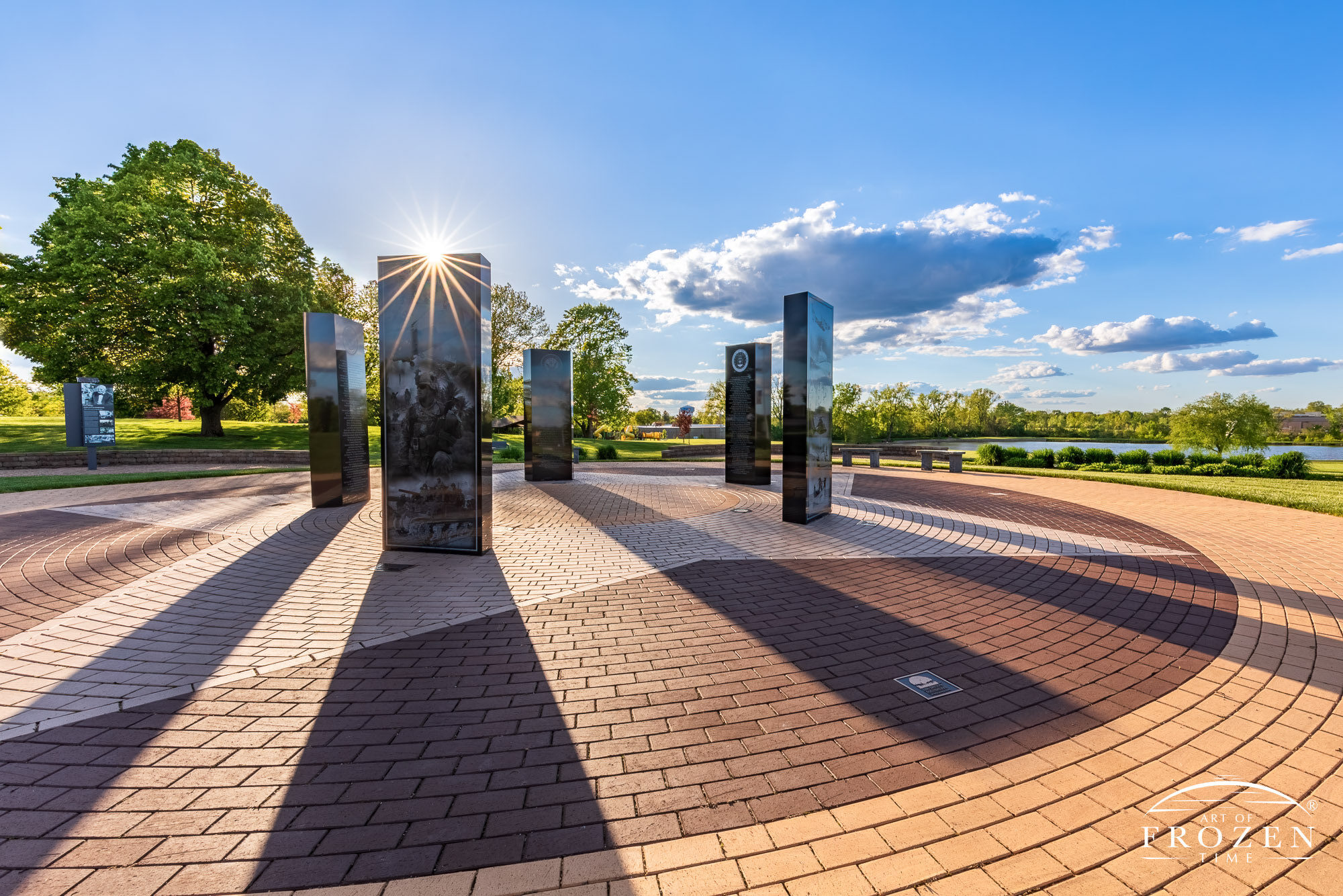 Kettering, Ohio Veterans Memorial where the setting sun paints the black granite memorials in golden light