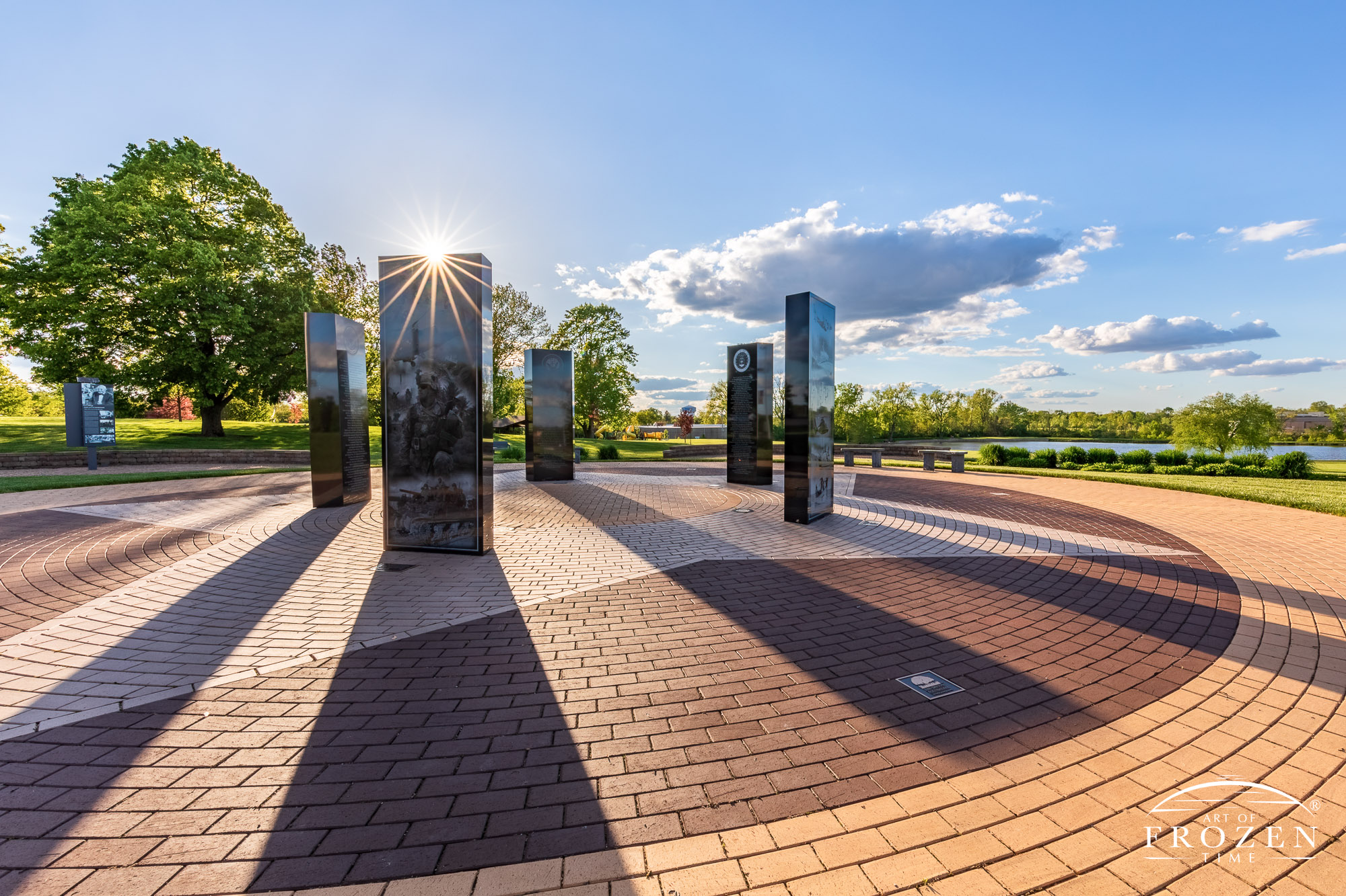 Kettering, Ohio Veterans Memorial where the setting sun paints the black granite memorials in golden light