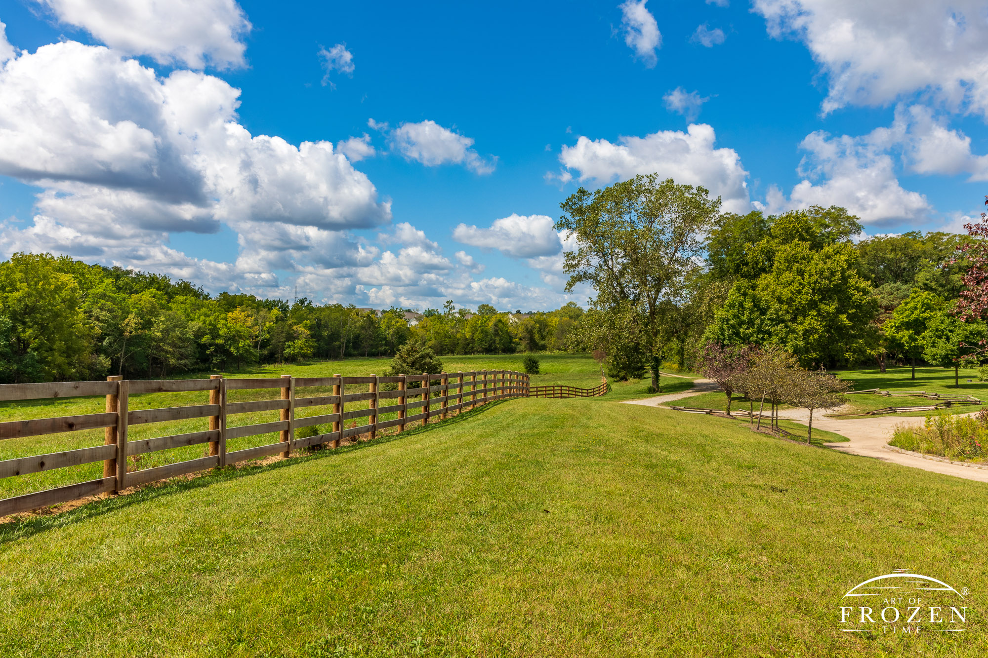 A horse pasture fence at Carriage Hill MetroPark following the rolling terrain