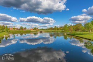 A perfect spring evening as cumulus clouds float over Indian Riffle lake in Kettering Ohio