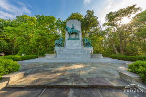 A summer view of the John H. Patterson Memorial where the sun filters the morning light.