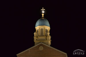 Moonrise over University of Dayton Chapel of the Immaculate Conception adorned in Christmas lights on the Long Nights Moon