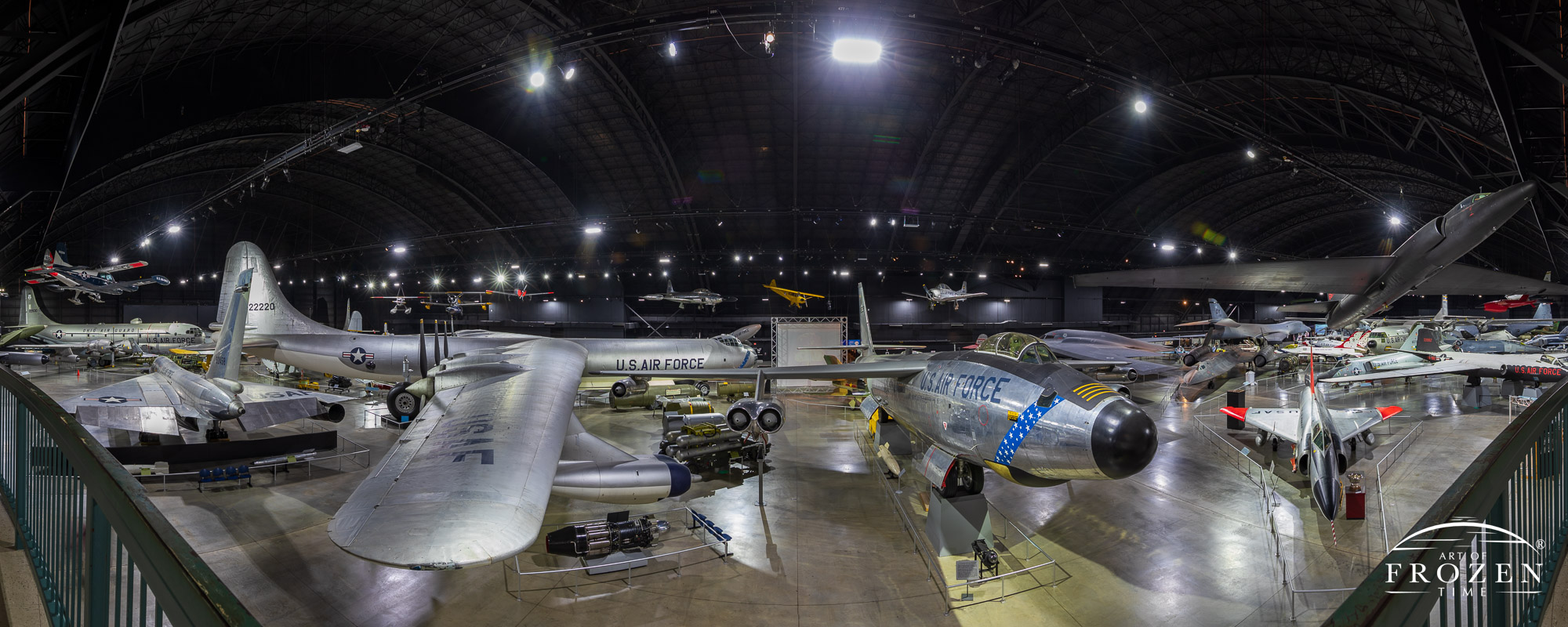 A panoramic view of a hanger in the National Museum of the US Air Force featuring aircraft which served in the Cold War