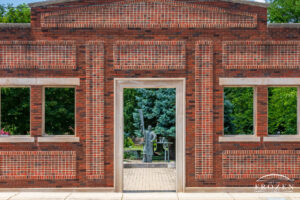 A red-brick wall replicating the façade of the Wright Aeronautical Laboratory which once stood on this site.