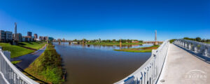 A panoramic view from the Deeds MetroPark Pedestrian Bridge capturing the confluence of the Mad River and Great Miami River