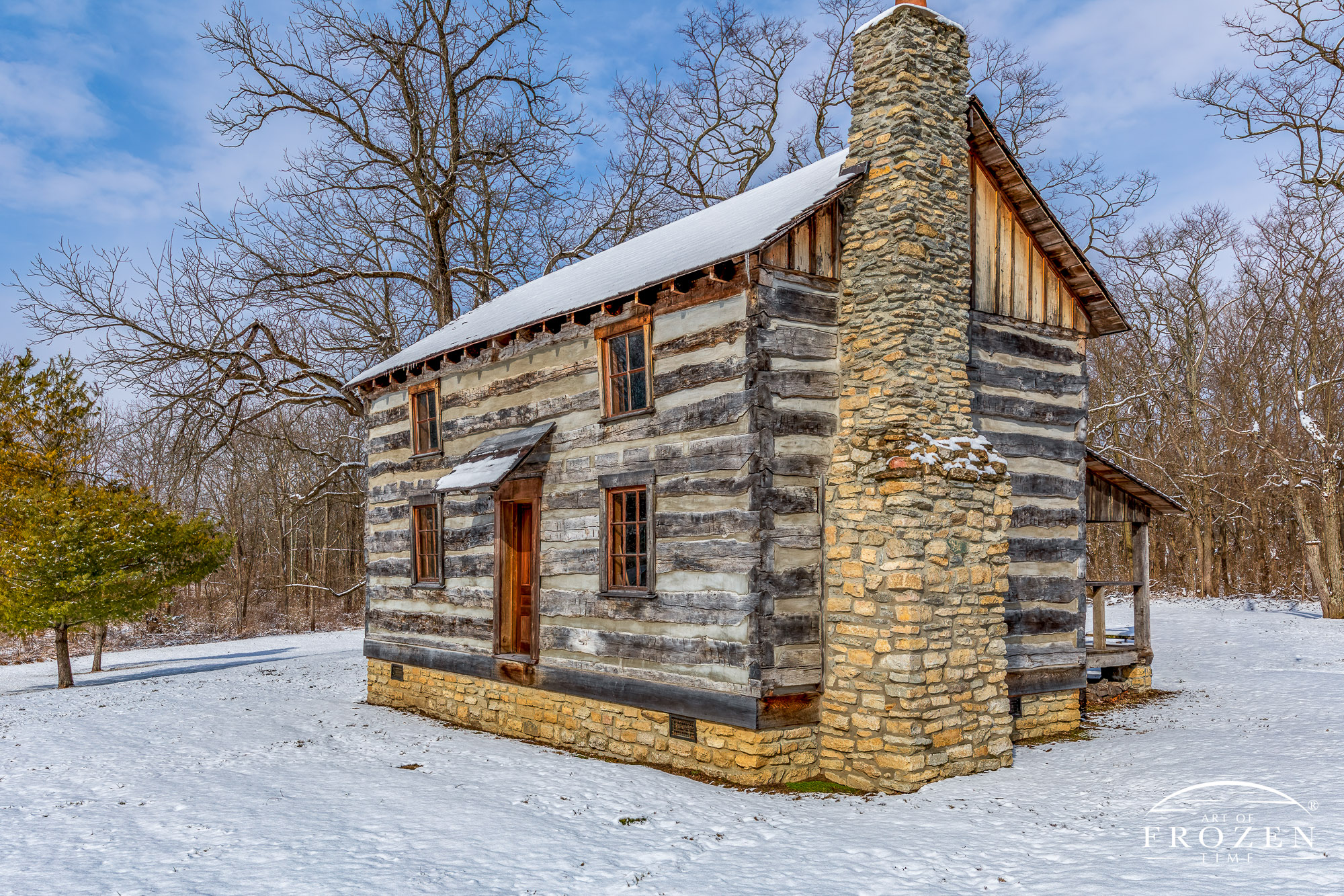 An Ohio log home surrounded by a field of snow