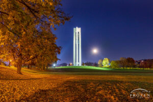 A full moon rising next to Dayton’s bell tower on an autumn evening which coincides with Halloween.