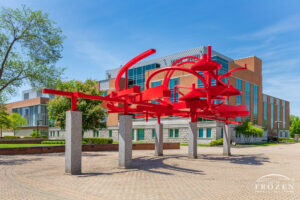 A bright red sculpture at Wright State University consist of curving pieces of aluminum represents the feeling of flight