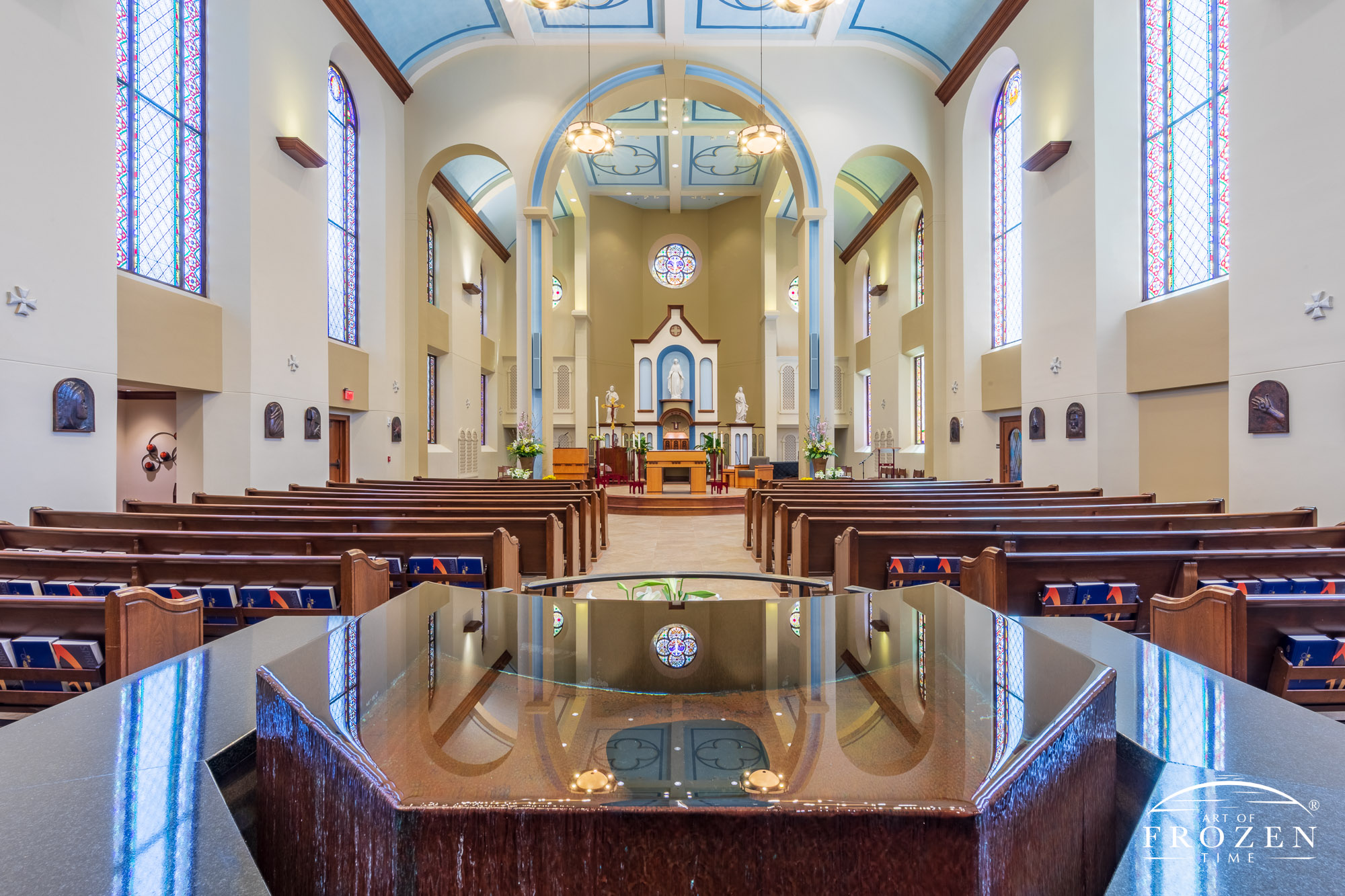 Wide-angle view of the baptismal near the entrance of University of Dayton's Chapel of the Immaculate Conception