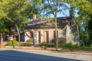 One of the oldest stone houses in Centerville Ohio as the golden morning light rakes across the facade