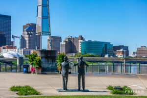 Life-size sculpture of the Wright Brothers depicts them in conversation in front of the Dayton Skyline
