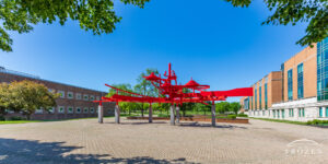 A bright red sculpture at Wright State University consist of curving pieces of aluminum represents the feeling of flight