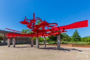 A bright red sculpture at Wright State University consist of curving pieces of aluminum represents the feeling of flight