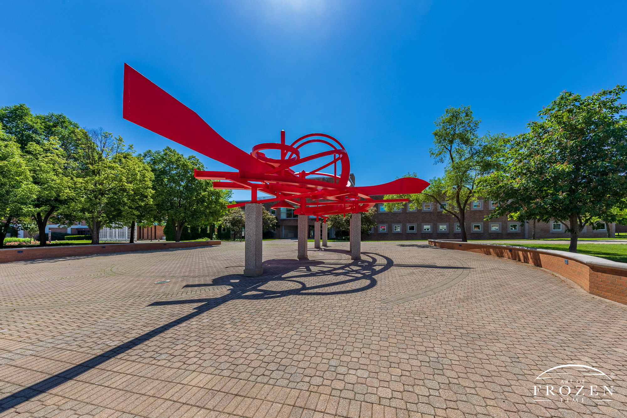 A bright red sculpture at Wright State University consist of curving pieces of aluminum represents the feeling of flight