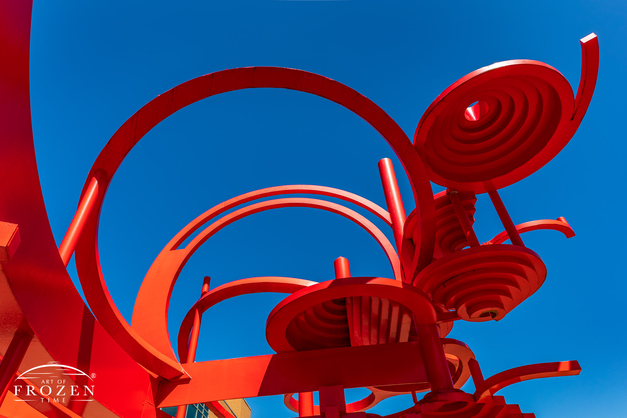 A bright red sculpture at Wright State University consist of curving pieces of aluminum represents the feeling of flight