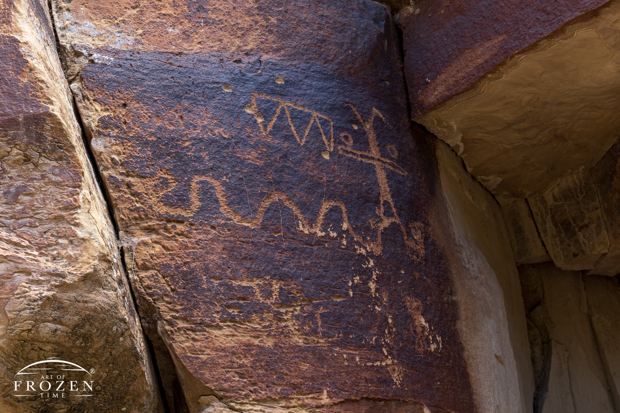 A petroglyph that was tapped into the rock varnish by native people 1,000 years ago depicting aspects of their life they wanted to share.