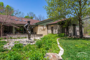 The Brukner Nature Center entrance welcomes families as they walk by the bronze sculpture of Clayton Brukner