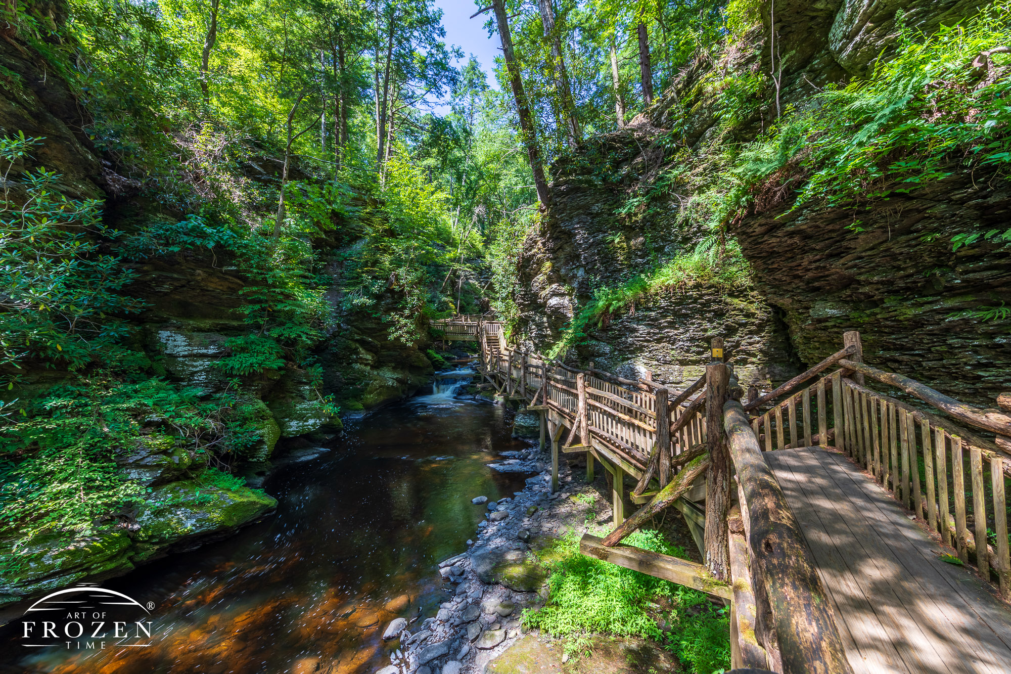 A woodend walkway built along a small gorge which safely guides visitors along a stream.