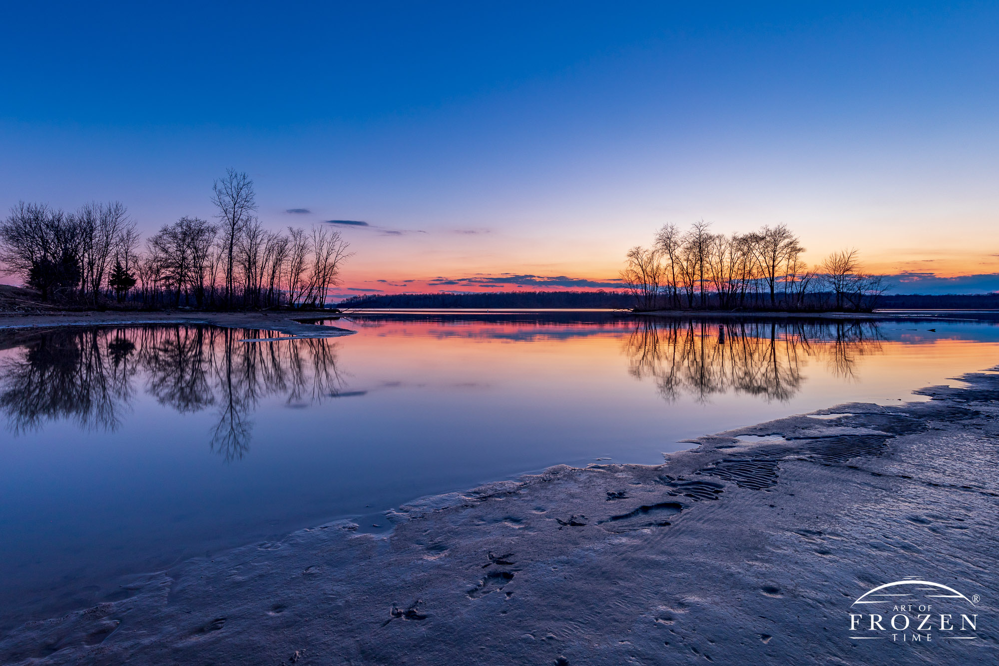 A colorful twilight over Caesar Creek State Park and a still wind produces a perfect mirror reflection and a minimalistic composition.
