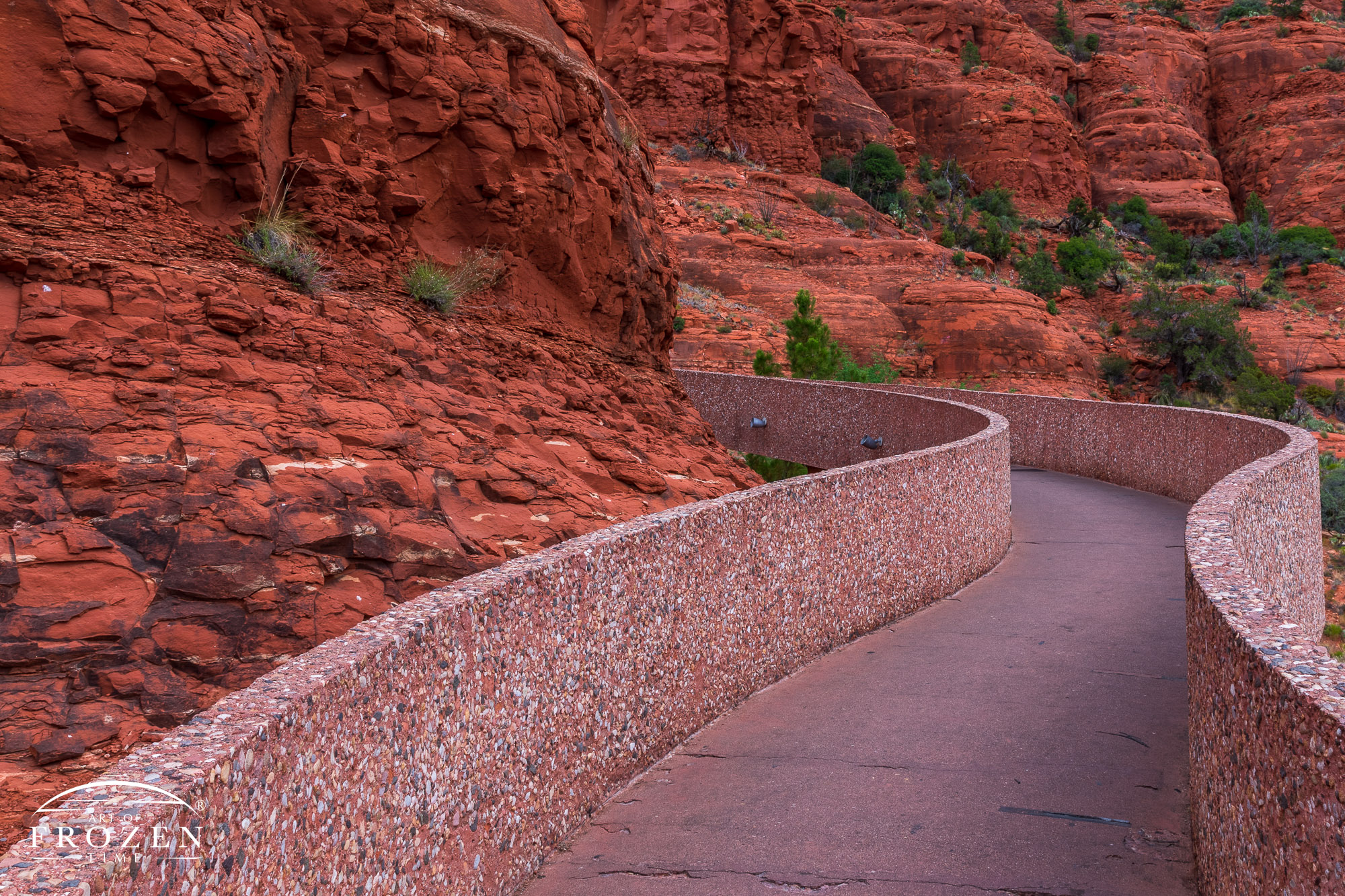 The smooth serpetine walls of a sidewalk leading visitors up to the Chaple of the Holy Cross in Sedona