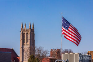 A decorative church steeple and a large US Flag occupy the sky above Springfield Ohio