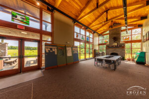 An interior view of the Davidson Interpretive Center whose expansive windows allow visitors to see the Battle of Peckuwe site.