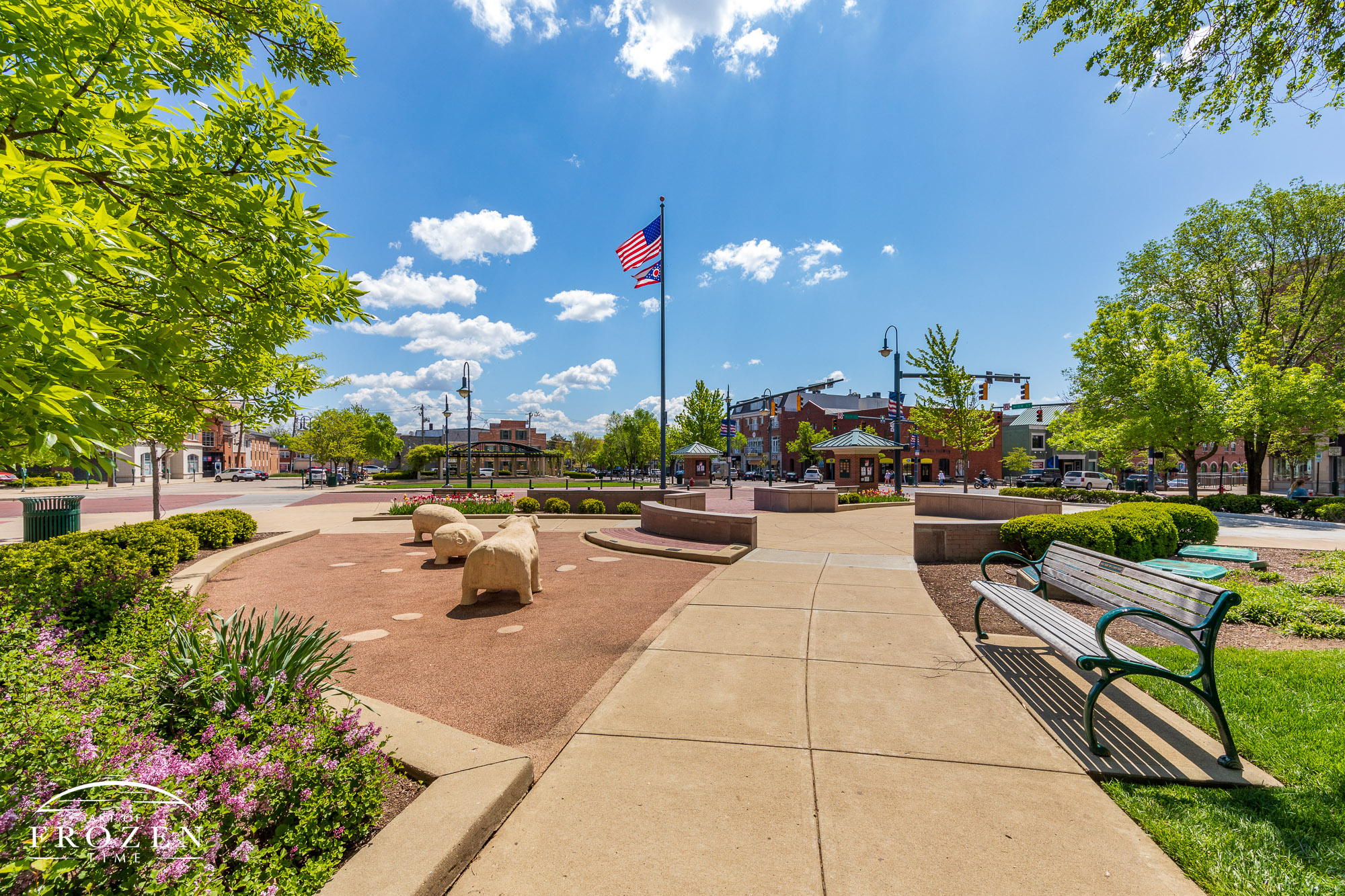 Flower beds leads the eye towards the center of Doctor Martin Luther King Jr Park under sunny skies over Oxford, Ohio