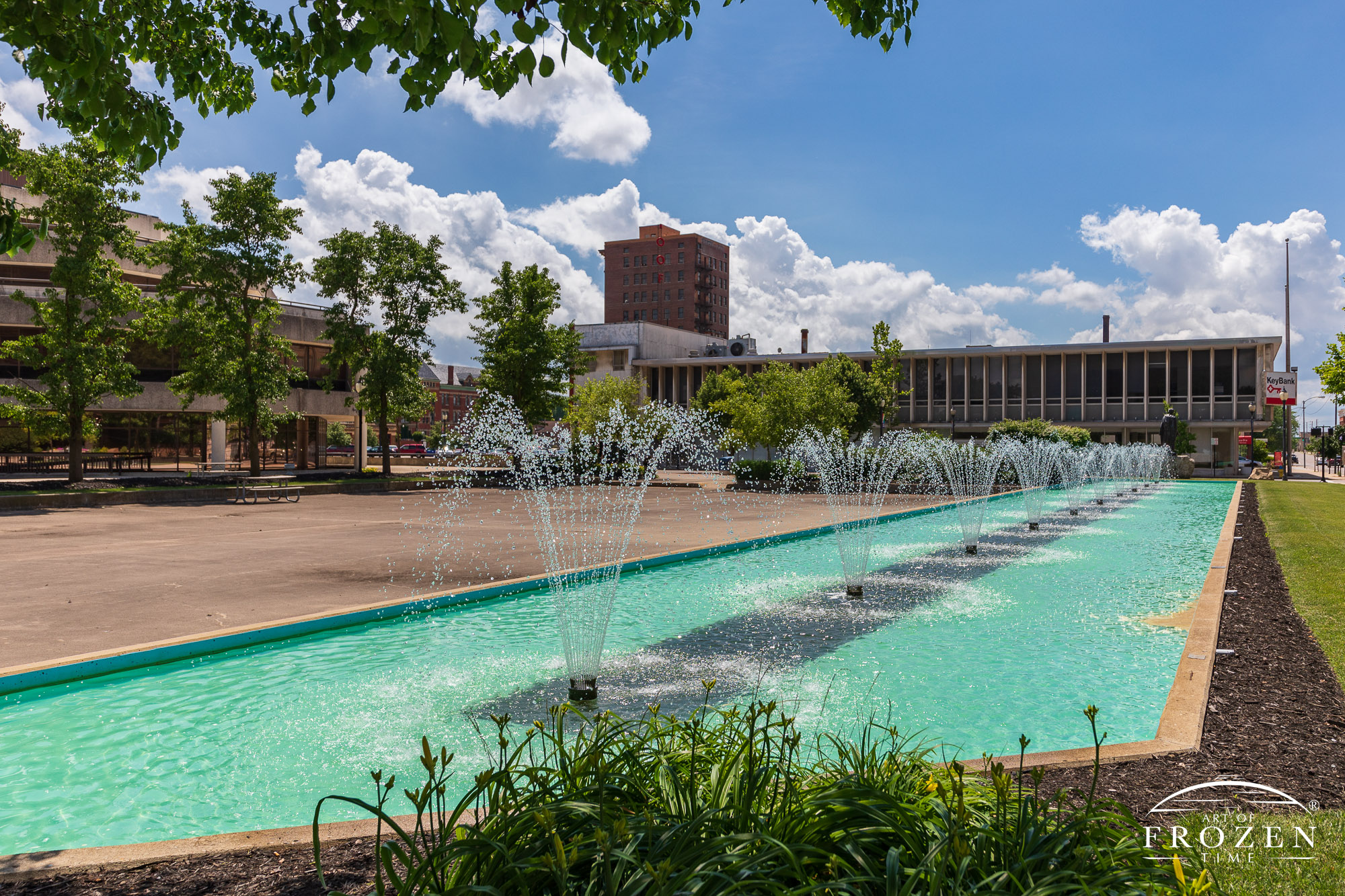 A long view of Springfield Ohio's 150-foot long City Hall Plaza Fountain on a pretty summer day