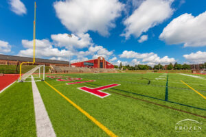 Hosting football and track since 1923, Wittenberg University Tigers field lies under blue skies and cumulus clouds