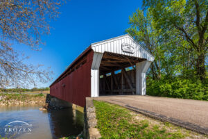 The Eldean Covered Bridge still supports Miami County vehicle traffic across the Great Miami River with its red and white paint design