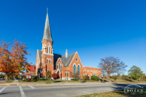 Sidney Ohio’s The First Presbyterian Church where its tall steeples climb into the blue azure skies of autumn