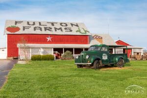 A Miami County Ohio attraction, Fulton Farms Market lies inside this red barn with roof tiles carrying the farm name and iconic strawberry