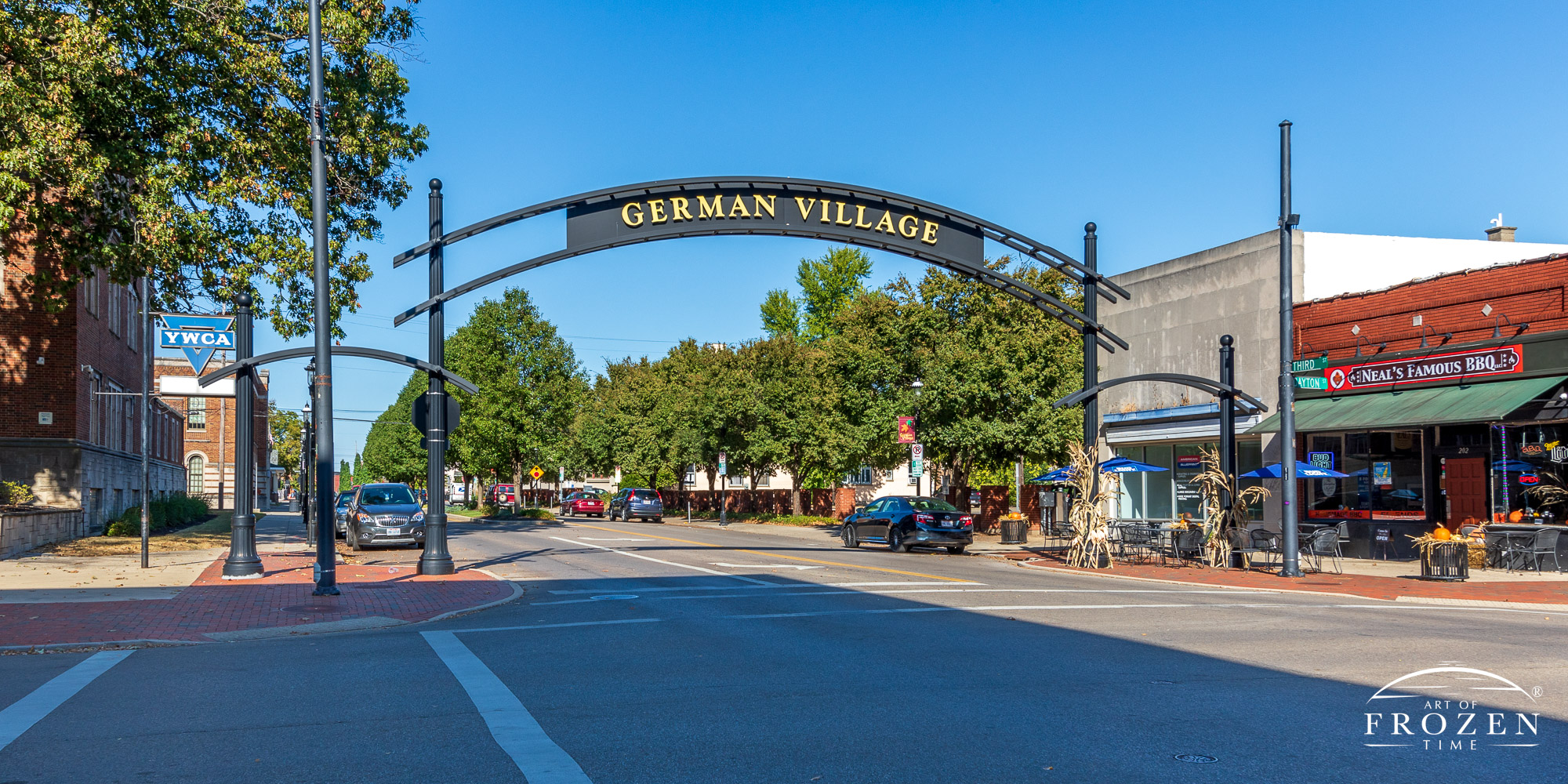 A steel sign arching over North Third Street in Hamilton Ohio designating the German Village Historic District entrance