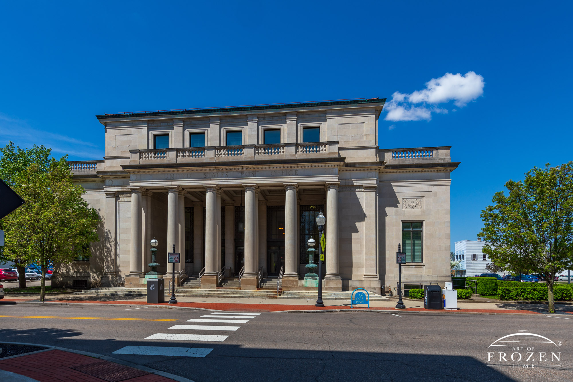 The Piqua Ohio Post Office front elevation which captures its Neo-Classical Revival Style using stone columns