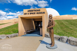 Neil Armstrong Statue, Wapakoneta Ohio No. 4 | Art of Frozen Time A bronze statue of Neil Armstrong dressed as a test pilot to include his flight helmet and oxygen mask