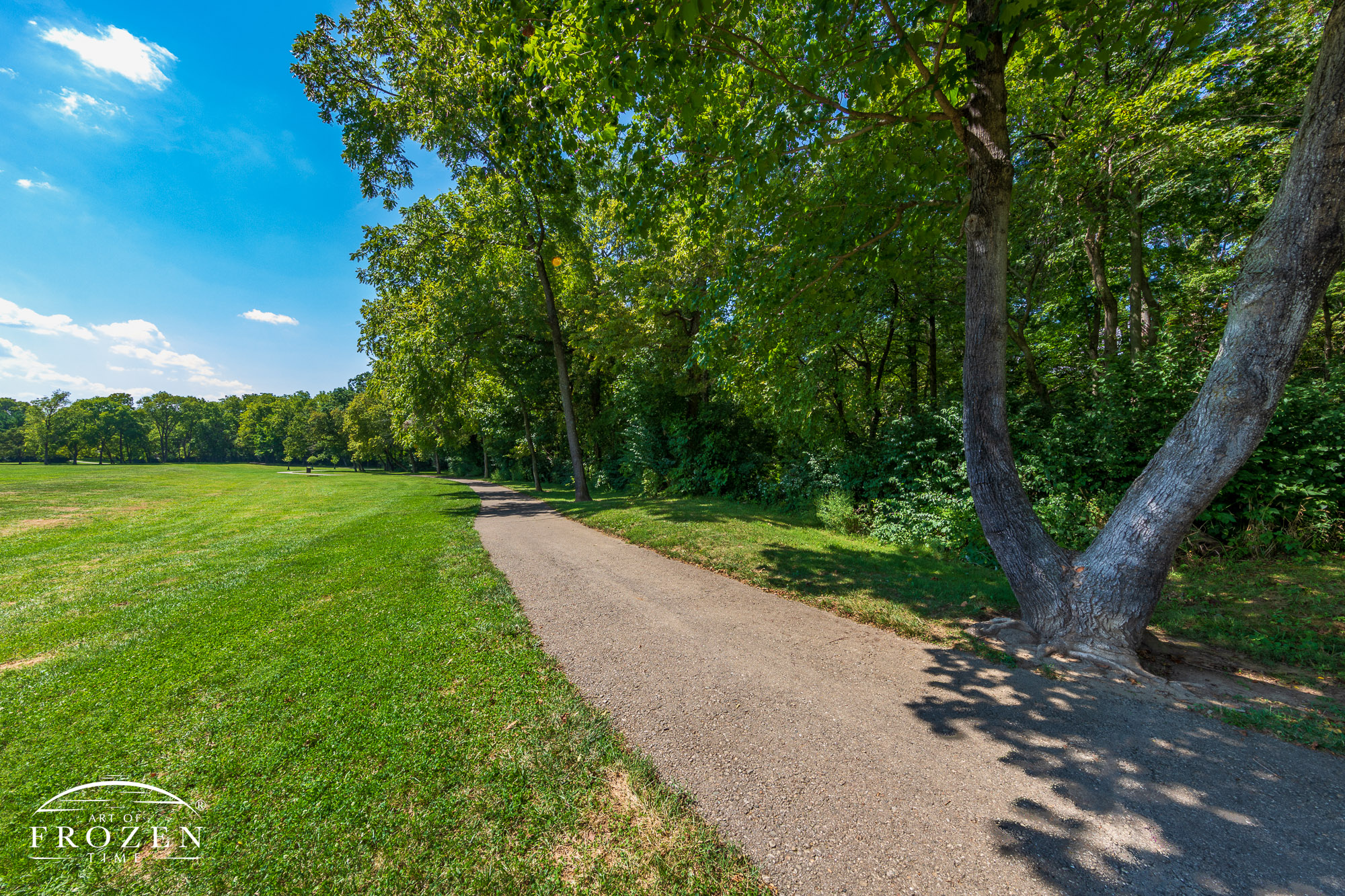 A walking path at North Park in Springboro Ohio which takes visitors along the shady treeline