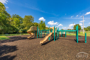 Playground equiupment at North Park where the facilities lie under blue skies